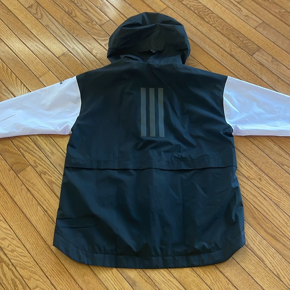Adidas women’s waterproof jacket in lilac and navy blue size medium